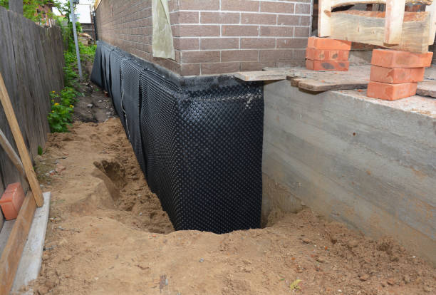 SJ Waterproofing Pros technician performing targeted Emergency Waterproofing assessment in Graytown, OH